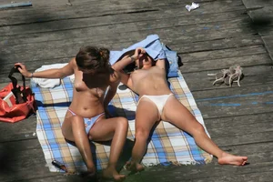 Two teens stripping and going topless to tan
