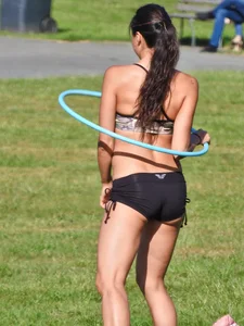 Fit brunette posing in the park. With hoops! [011]