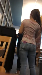 Very cute teen candid girl wearing tight jeans with a phone in back pocket