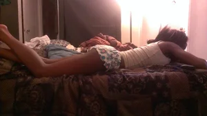 Black sexy girlfriend laying around in little shorts