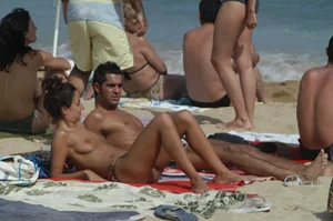Topless girls on a beach in Barcelona