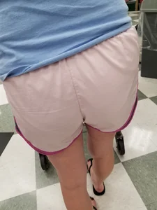 Nice blonde ass in athletic shorts while shopping