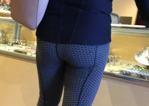 Brunette jewelry shopping in leggings with a nice ass