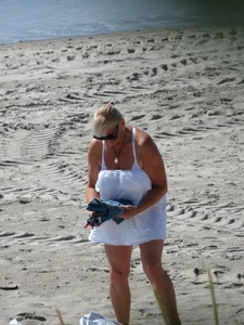 Mature blonde lady on a nude beach with big boobs