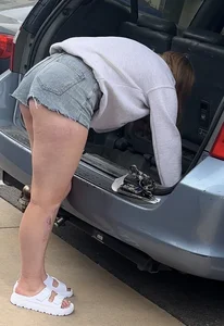 College chick in short shorts bending over with cheeks out