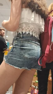 Teen with sexy legs in short jean shorts