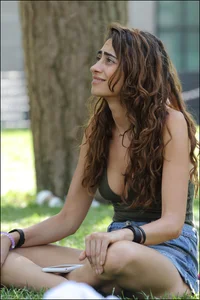 Gymnast or yoga girl in the park in shorts and no bra and even showing some pussy