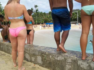 Sexy friends on vacation in pink and black bikinis with decent asses