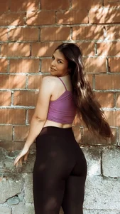 Non-candid hottie in a crop top and leggings