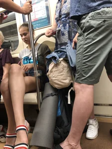 Tall Candid Teen Girl in Denim Shorts And Sandals Sitting in the Subway Train, Then Walking Down the Station