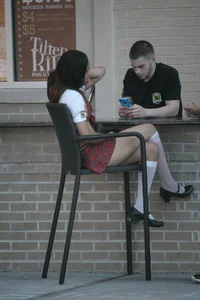 Two sexy Tilted Kilt employees showing cleavage and cheeks