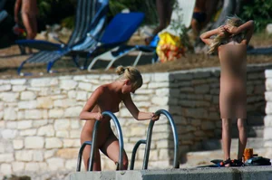 Sexy and skinny blonde nudist milf on the beach