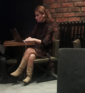 Milf in knee high boots working in a cafe