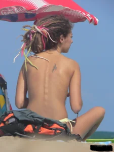 Sexy girls going topless at the beach showing off their sexy bodies