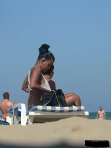 Hot ass topless beach girl with great tits lets her little brother oil up her ass in thong bikini