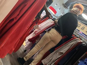 Bunch of girls in various outfits at a Cardinals baseball game