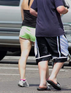 Blonde girl in glasses with a thick booty in green shorts