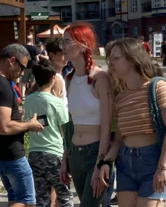 A Group of Teens Street Photos, a Tall Glasses-Wearing Red-Headed Teen in a Top With Nice Abs