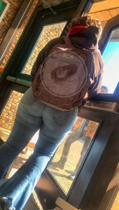 Thick college girl at bus stop in tight jeans
