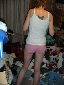 Skinny Candid Girl in Pink Panties Standing in the Messy Apartment