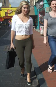 Sexy blonde out walking in green leggings with vpl