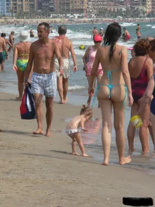 Bunch of sexy babes at the beach in thong bikinis