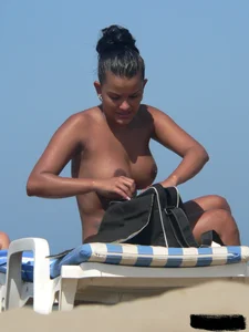 Hot ass topless beach girl with great tits lets her little brother oil up her ass in thong bikini