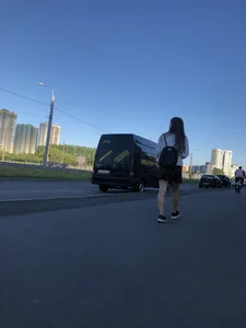 Extremely Cute Girl in a Skirt With a Backpack Passing By on the Street Gallery
