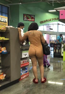 Latina with hard nipples and a big booty in tight spandex shorts outfit
