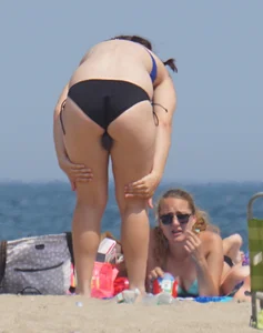 3 girls on the beach in bikinis with big boobs, one brunette and two blondes