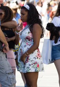 Black girl showing major cleavage in dress and almost upskirted