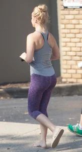 Sexy blonde out walking in purple leggings with a nice ass