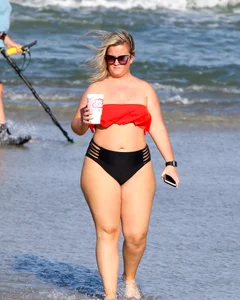 Thick BBW blonde lady in a bikini at the beach