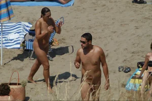 Girls on a nude beach in Sitges, Spain