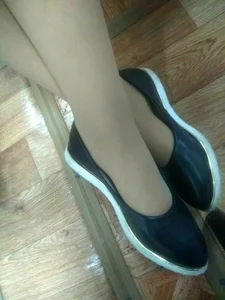 Crossed Legs of a Candid College Teen in Pantyhose Closeup Photo