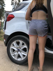 Hot Young Girl in a Top and Shorts Standing Barefoot Near Her Car Creepshot