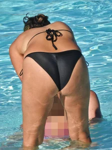 Sexy milf with a nice mom bod in a bikini in the pool