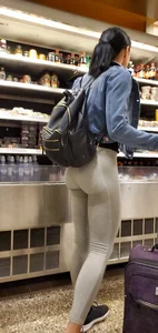 Beautiful brunette shopping in tight grey spandex with a great ass