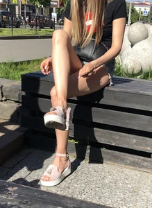 Girl in Denim Shorts with Amazing Hot Legs Fixing Her Sandals Street Candid Photo Gallery