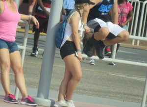 Couple of babes standing around in shorts