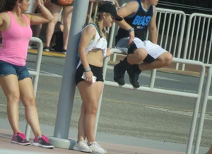 Couple of babes standing around in shorts