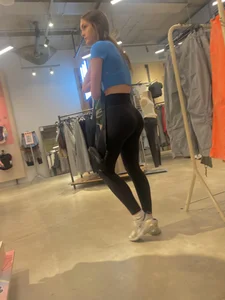 Tall Brunette Fills Out Her Leggings While Shopping