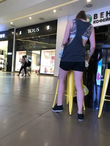 Tattoed Girl in Shorts and a Top Mall Candid Photo