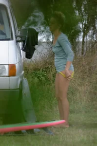Girl getting out of her swimsuit and changing her panties while flashing pubes