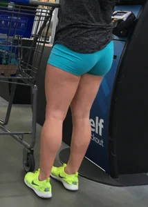 Big booty girl in blue spandex shorts shopping