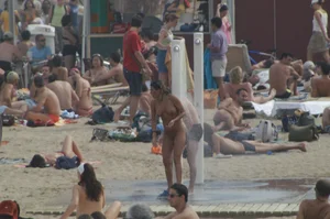 Topless girls on a beach in Barcelona