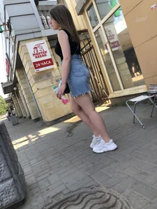 Hot chick wearing a fringed skirt walking up the stairs
