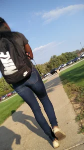 Skinny girl in tight blue jeans street photo