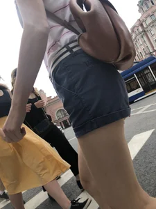 Young Girl in Shorts And Sandals Crossing the Street Gallery