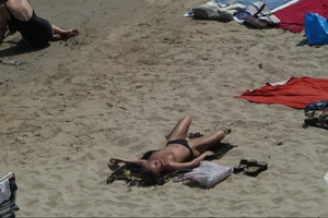 Girls on a nude beach in Sitges, Spain